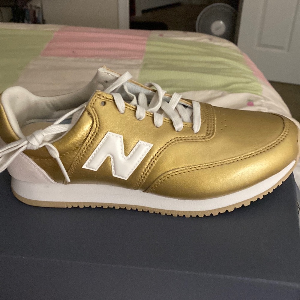 New balance gold athletic shoes!